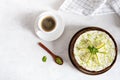 Lime cheesecake with peppermint. Cheesecake with cup of coffee on white background. Top view, copy space Royalty Free Stock Photo