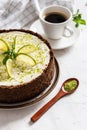 Lime cheesecake with peppermint. Cheesecake with cup of coffee on white background. Top view Royalty Free Stock Photo