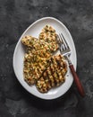 Lime, cilantro, garlic, mustard, olive oil marinated grilled chicken breast on a dark background, top view Royalty Free Stock Photo