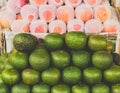 Lime citris fruits in supermarket. Limes green background.