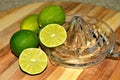 Lime citrus, whole and cut on glass juicer