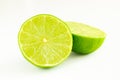 Lime cut in two halves of green color on white background Royalty Free Stock Photo