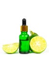 Lime essential oil in glass bottle for healthy. Royalty Free Stock Photo