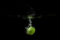 Lime fell into the water and raised a lot of splashes Royalty Free Stock Photo