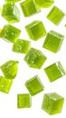 Lime flavored jelly cubes gently drifting with transparent background Royalty Free Stock Photo