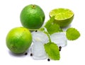 Lime fruit with melissa isolated on white Royalty Free Stock Photo