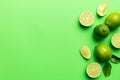 Lime fruits with green leaf and cut in half slice isolated on white background. Top view. Flat lay with copy space Royalty Free Stock Photo