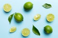 Lime fruits with green leaf and cut in half slice isolated on white background. Top view. Flat lay with copy space Royalty Free Stock Photo