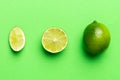 Lime fruits with green leaf and cut in half slice isolated on white background. Top view. Flat lay with copy space Royalty Free Stock Photo