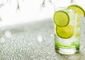 Lime in a glass with tonic