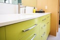 lime green bathroom cabinet with a sleek countertop