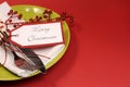 Lime green and red Merry Christmas table place setting, with copy space for your text here. Royalty Free Stock Photo