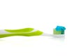 Lime green toothbrush and toothpaste on white Royalty Free Stock Photo