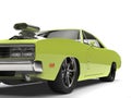 Lime green vintage American muscle car - front wheel closeup cut shot