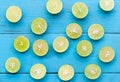 a Lime lemon are half cut on blue wooden background Royalty Free Stock Photo