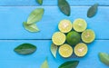 a Lime lemon are half cut on blue wooden background. Leadership Royalty Free Stock Photo