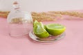 Lime and lemon on a pink background.lime slices and lemon in the cut Royalty Free Stock Photo