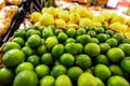 Lime and lemons background. Fresh organic lemons and lime on a local farmer food market on Bali island.