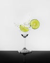 Lime martini splash photo shoot on black and white backgroud Royalty Free Stock Photo