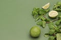 Lime and mint on green background