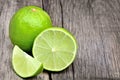 Lime on rustic wood board background Royalty Free Stock Photo