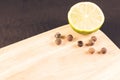 lime segment and spices on a empty cutting board/lime segment an Royalty Free Stock Photo