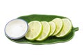 Lime sliced on a green plate with salt. Royalty Free Stock Photo