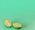 Lime slices on a light green background. Exotic healthy fruit. Royalty Free Stock Photo