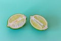 Lime slices on a light green background. Exotic healthy fruit Royalty Free Stock Photo