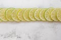 Lime slices in row on a light background copy space