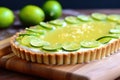 a lime tart with zested limes on a board Royalty Free Stock Photo