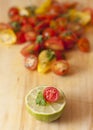 Lime, tomato and cilantro in front