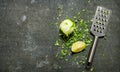 Lime zest and grater . Lime background. On stone table. Royalty Free Stock Photo