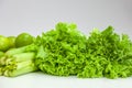 Limes, fresh celery stalk and lettuce Royalty Free Stock Photo