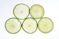 Limes slices on a bright background Royalty Free Stock Photo