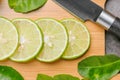 Limes slices on wooden with leave Royalty Free Stock Photo