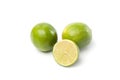 Limes on white, one cut half Royalty Free Stock Photo