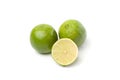 Limes on white, one cut half Royalty Free Stock Photo