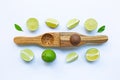 Limes with wooden lime Squeezer
