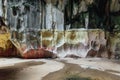 Limestone cave texture with color painted below inside Batu Caves near Kuala Lumpur, Malaysia. Royalty Free Stock Photo