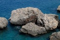 Limestone cliffs by sea. Waves beat on the rocks Royalty Free Stock Photo