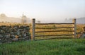 Limestone fence and misty landscape.TN Royalty Free Stock Photo