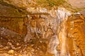 Limestone formations on the wall of an underground cave. Stalact Royalty Free Stock Photo
