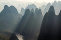 Limestone hills in silhouette at sunrise over Li River, China Royalty Free Stock Photo