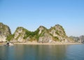 Limestone island rock in the sea bay near fish farm Royalty Free Stock Photo