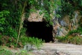 Limestone karst tunnel at Mirror Lake or Tasik Cermin in Ipoh, Perak, Malaysia. Royalty Free Stock Photo