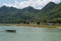 Limestone Landscape with River, Boat, Village and Church,