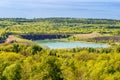 Limestone quarry with a lake and forest Royalty Free Stock Photo