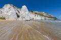Limestone rock monolith and cliffs by the beach, Vieste, Gargano, Apulia, Italy