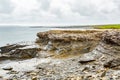 Limestone rocks with Doolin bay in the background Royalty Free Stock Photo